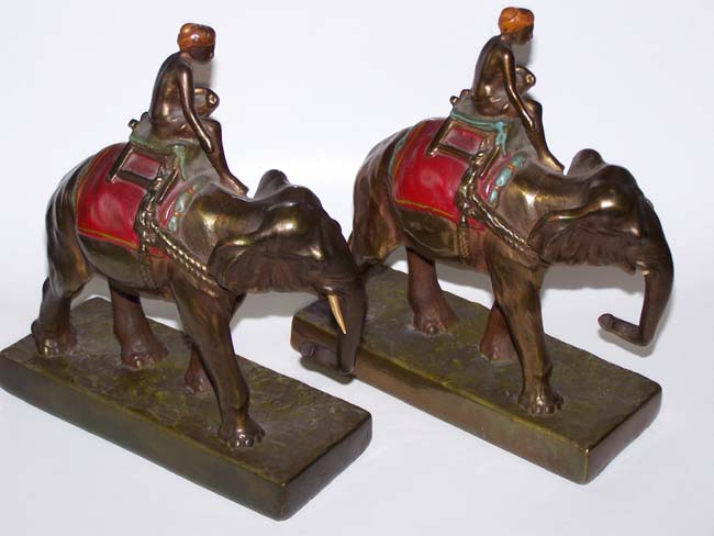 A fine and unusual Pair of Antique Bookends circa 1930 depicting a turbaned man riding an Elephant